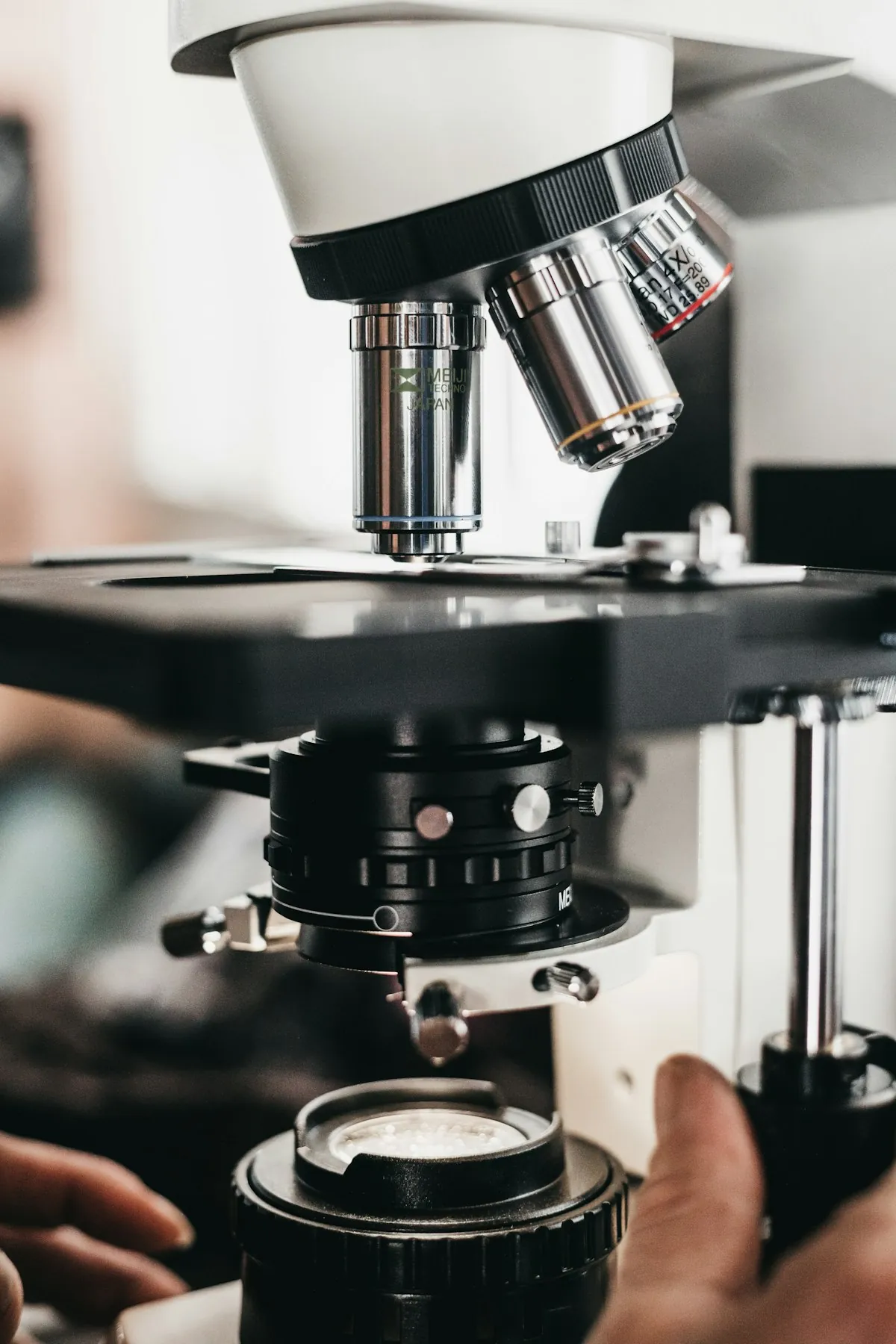 An engineer adjusting a precision instrument