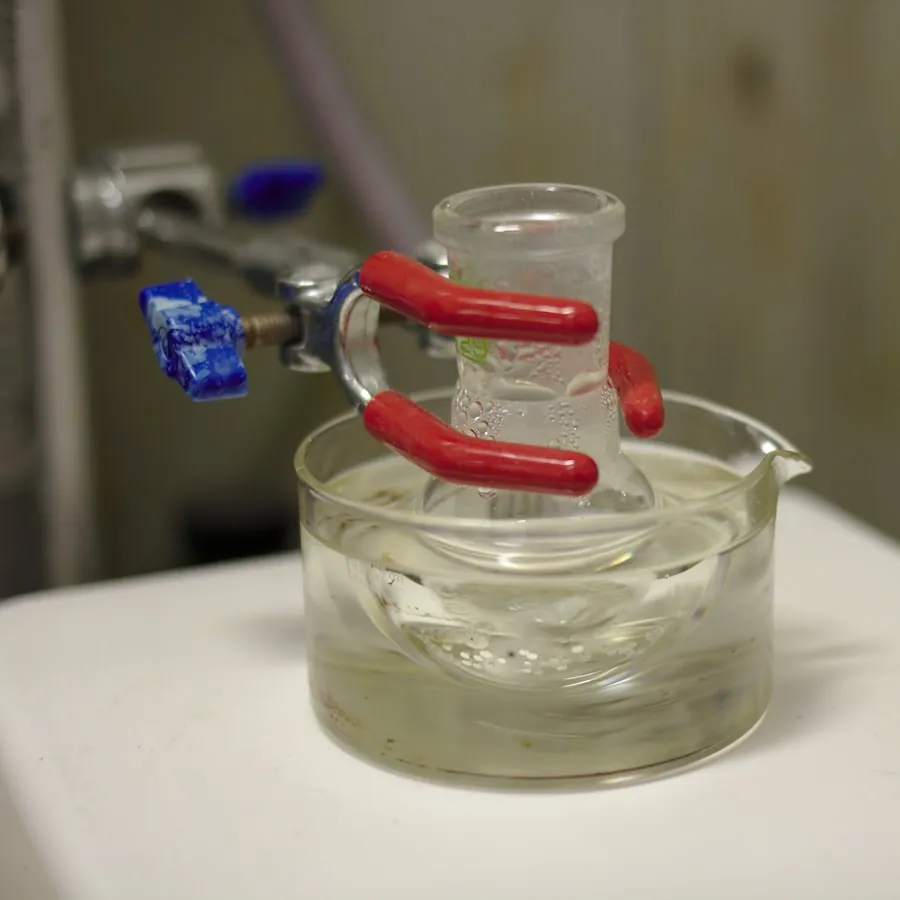 A flask held in a heated laboratory water bath